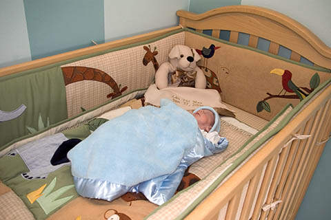 Landon in his crib